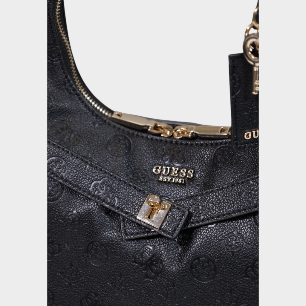 Esmire & Co Guess black polyurethane handbag with embossed logo pattern, gold-tone metal hardware, and zip closure.