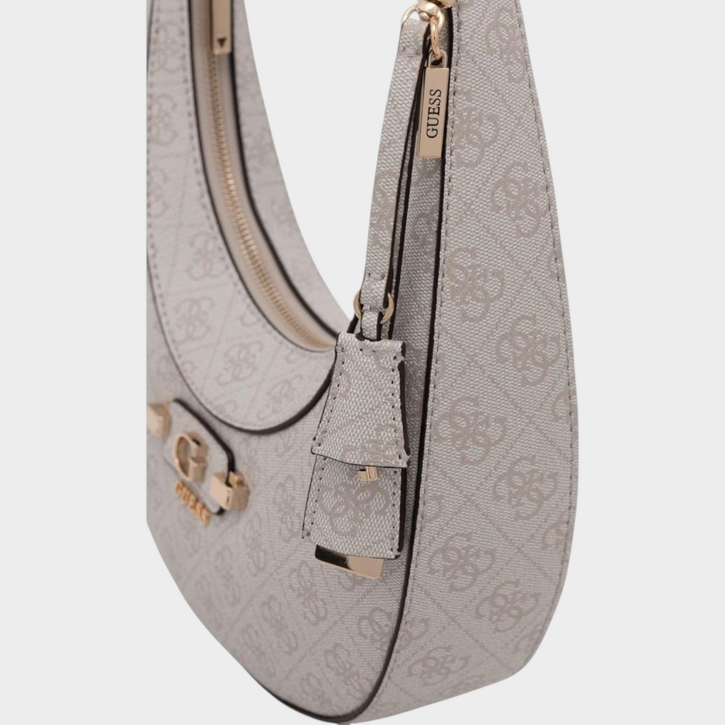 Esmire & Co white Guess crescent handbag with all-over logo print, gold-tone hardware, and a single shoulder strap.