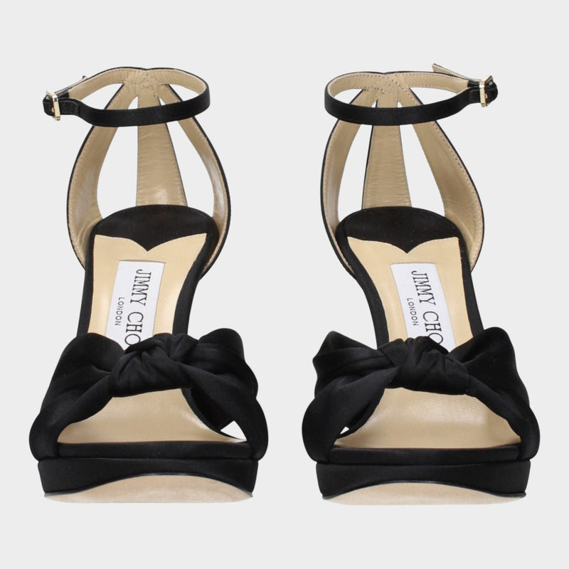 Esmire & Co Jimmy Choo Rosie black satin platform heels with a knotted front strap and adjustable ankle buckle.