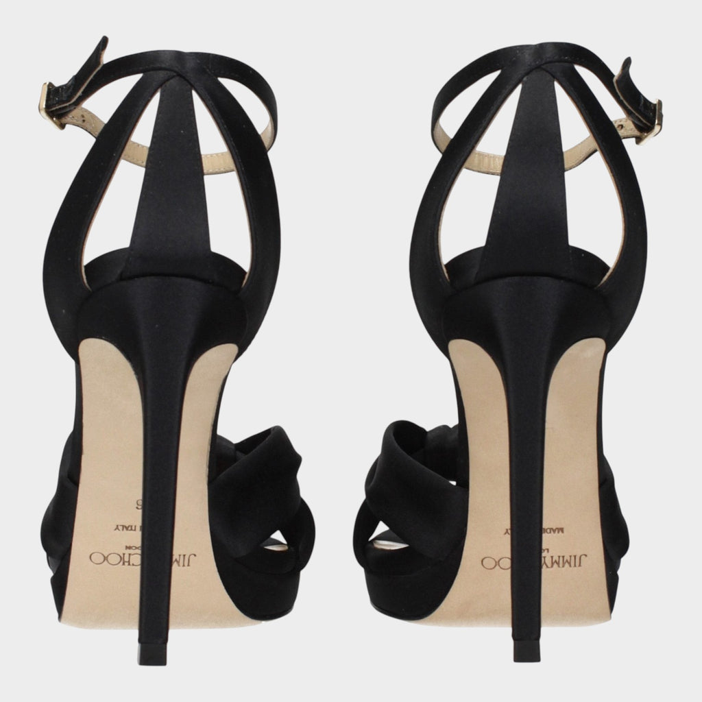 Esmire & Co Jimmy Choo Rosie black satin platform heels featuring a sleek stiletto heel and elegant back strap design.