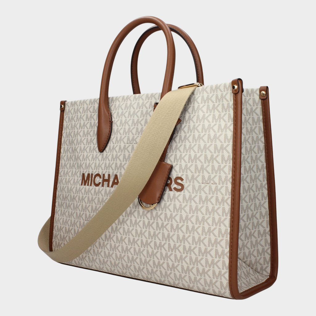 Esmire & Co Michael Kors beige Mirella tote bag with signature logo print, brown leather handles, and shoulder strap.
