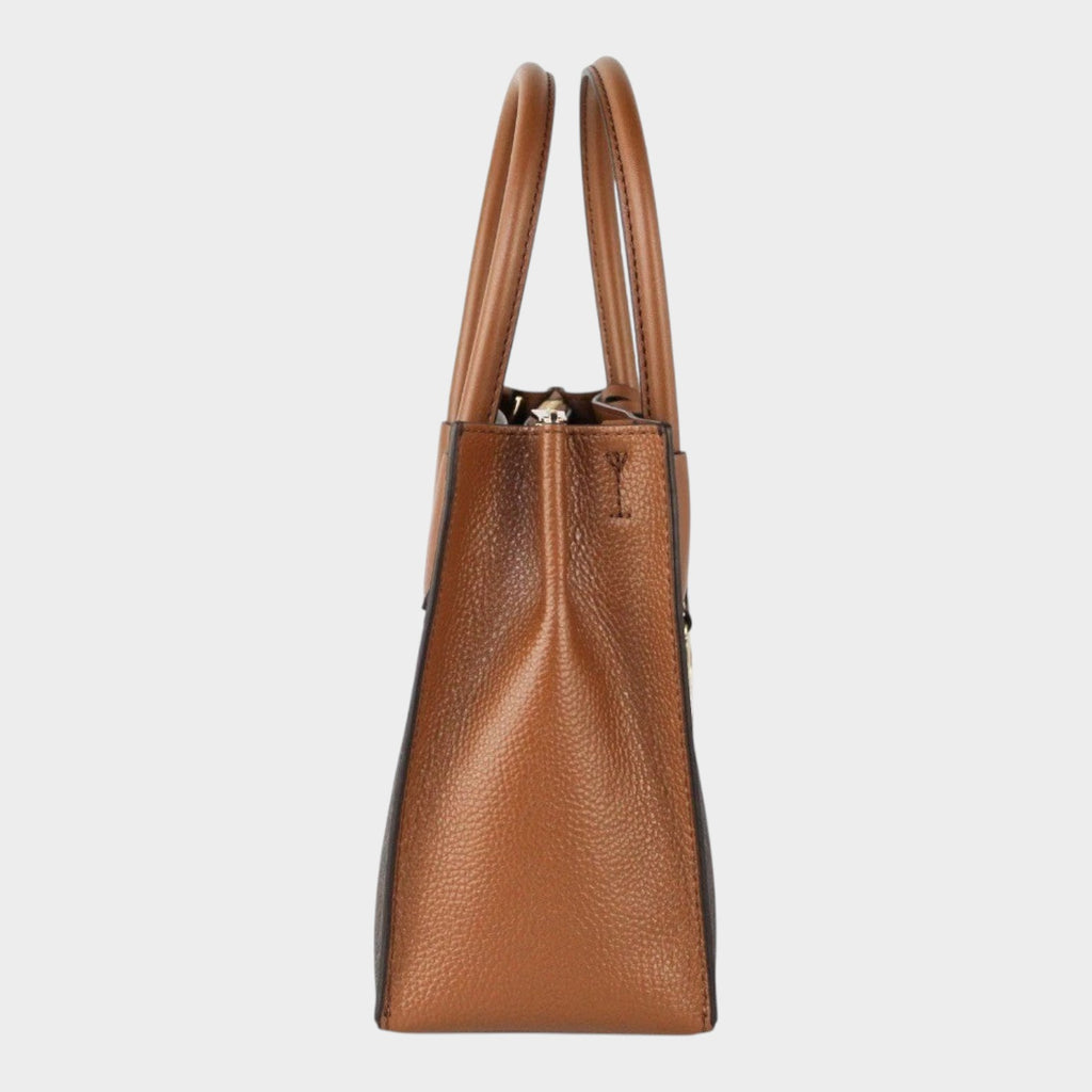 Side view of Esmire & Co Michael Kors brown leather Mercer accordion crossbody bag with structured top handles.