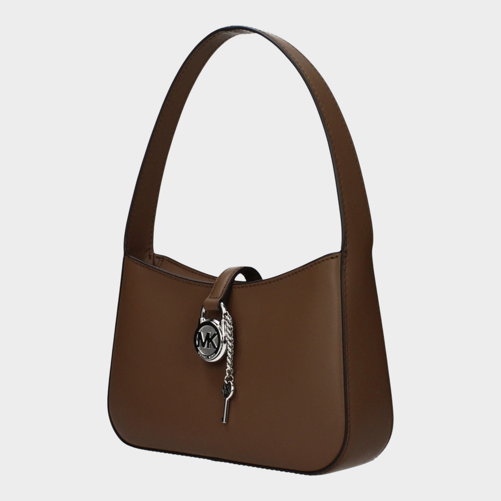 Esmire & Co Michael Kors driftwood brown leather handbag with a structured silhouette and silver logo charm detail.