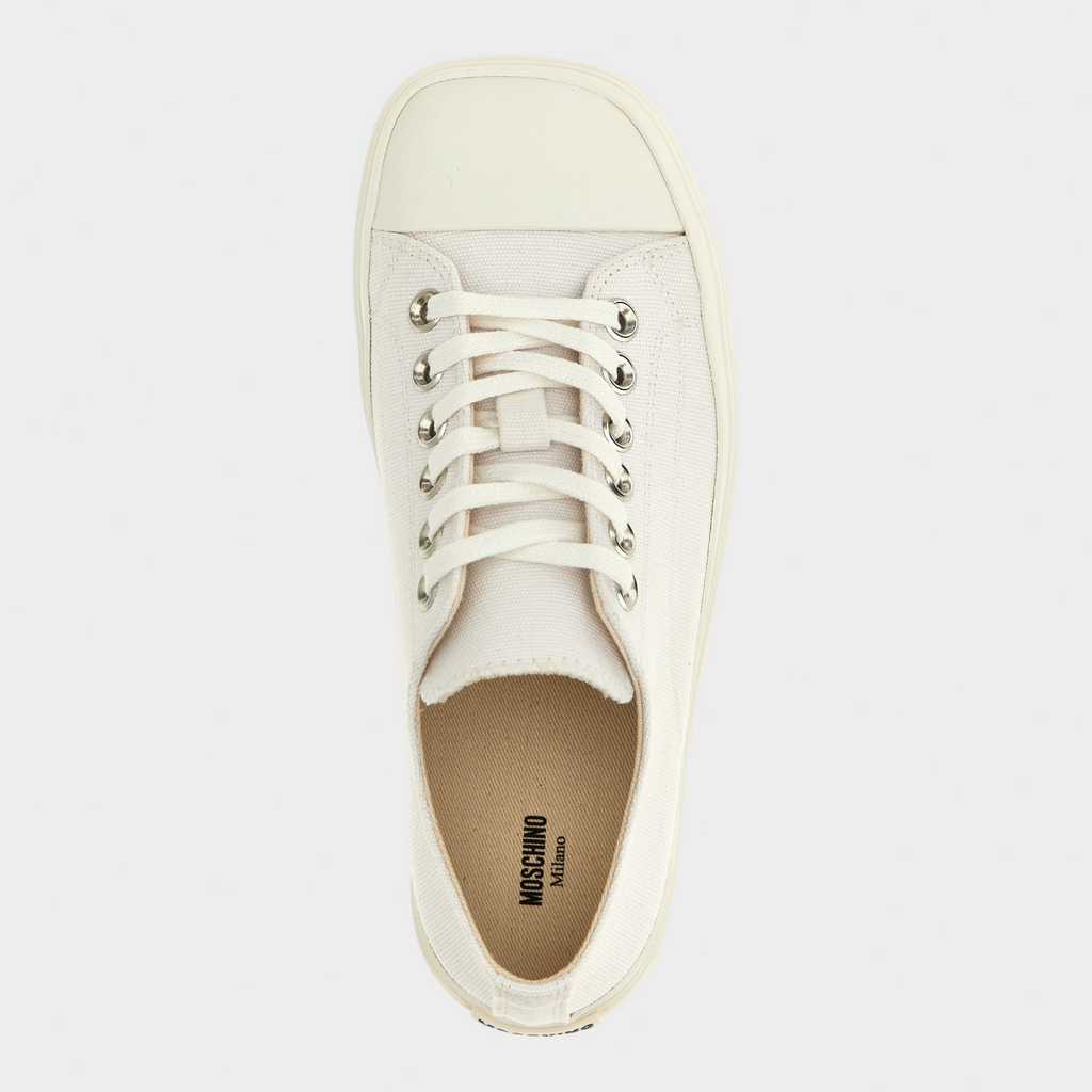 Esmire & Co MOSCHINO white cotton canvas low top sneakers with a square toe and lace-up closure, top view.
