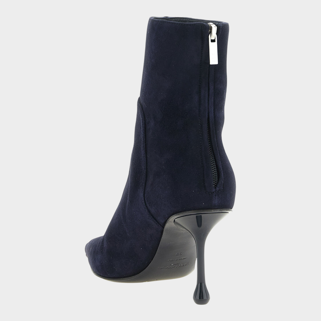Esmire & Co navy blue suede Jimmy Choo Cycas ankle boots with a back zip and distinctive drop heel, rear view.