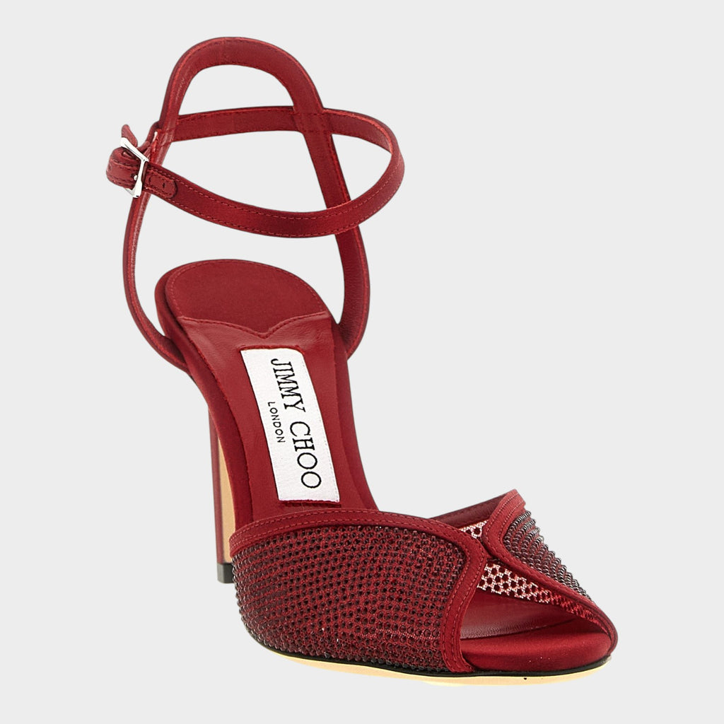 Esmire & Co red lamb leather stiletto sandals with micro crystal embellishments and an ankle strap buckle closure.