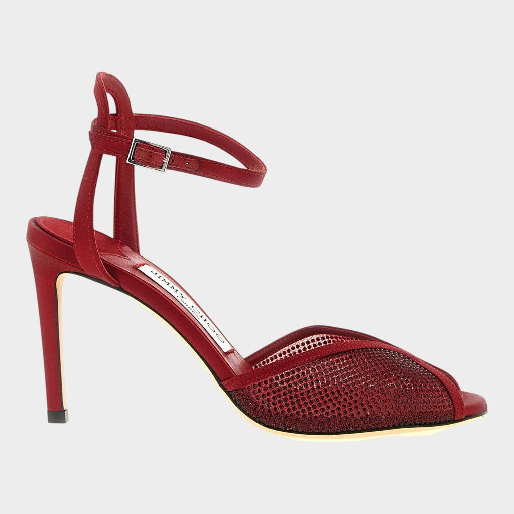 Esmire & Co red lamb leather stiletto sandals with micro crystal embellishments and an open V-neck toe design.