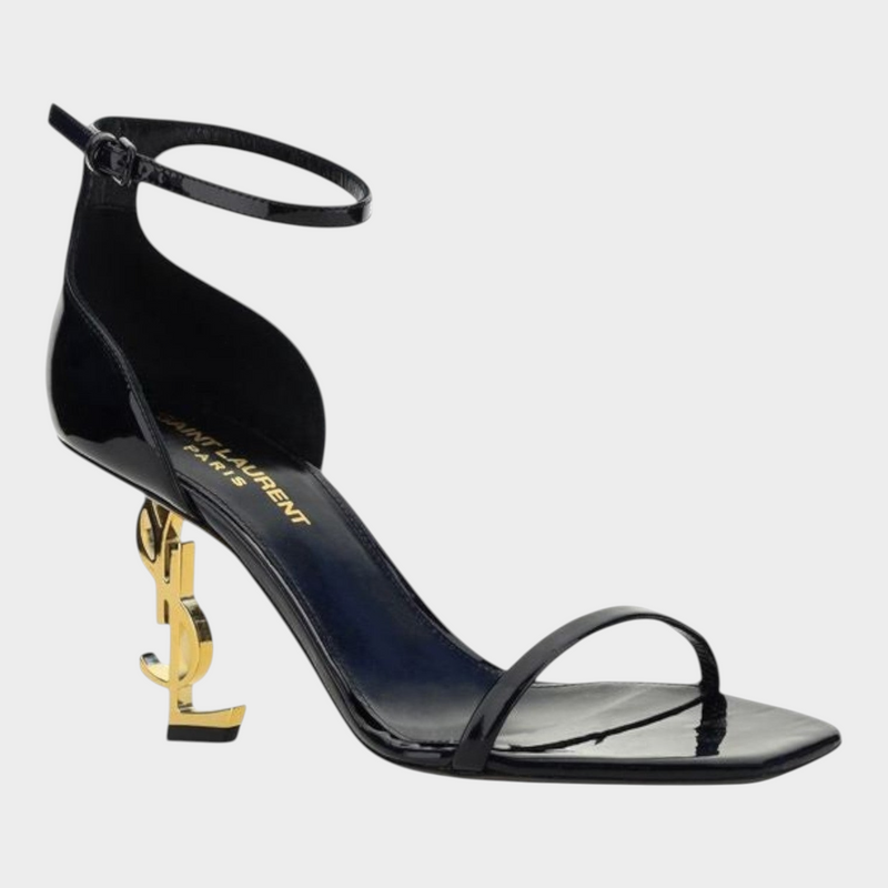Esmire & Co Saint Laurent black patent calf leather Opyum sandals with a gold-plated sculptural YSL logo heel.