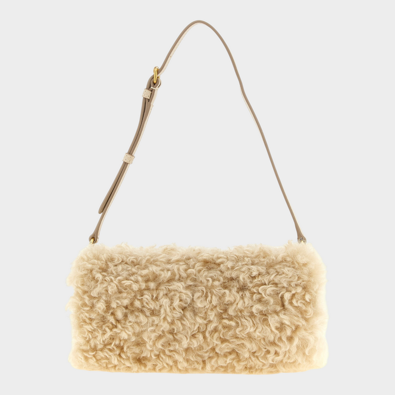 Esmire & Co Stella McCartney beige cylindrical clutch bag with plush sheepskin-effect texture and adjustable strap.