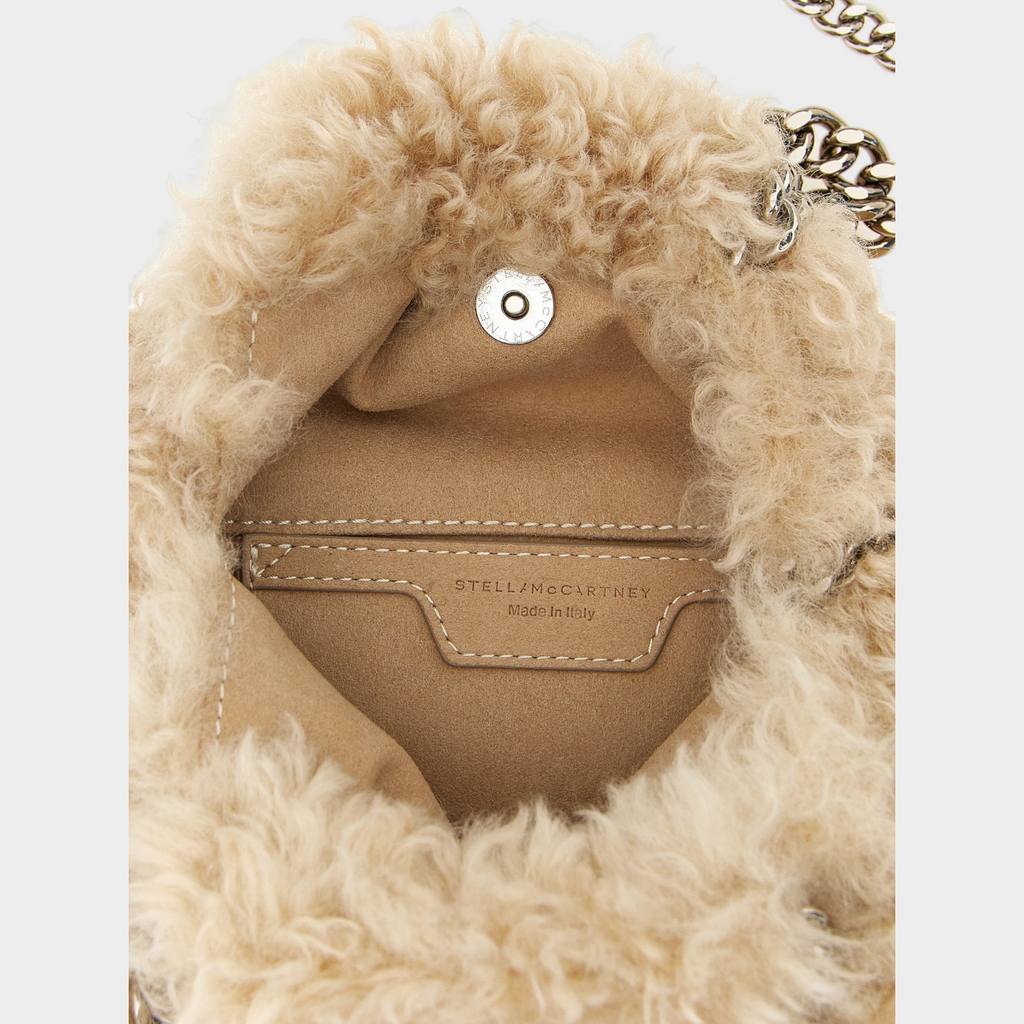 Esmire & Co Stella McCartney beige faux shearling Falabella mini handbag interior with silver chain and logo tag