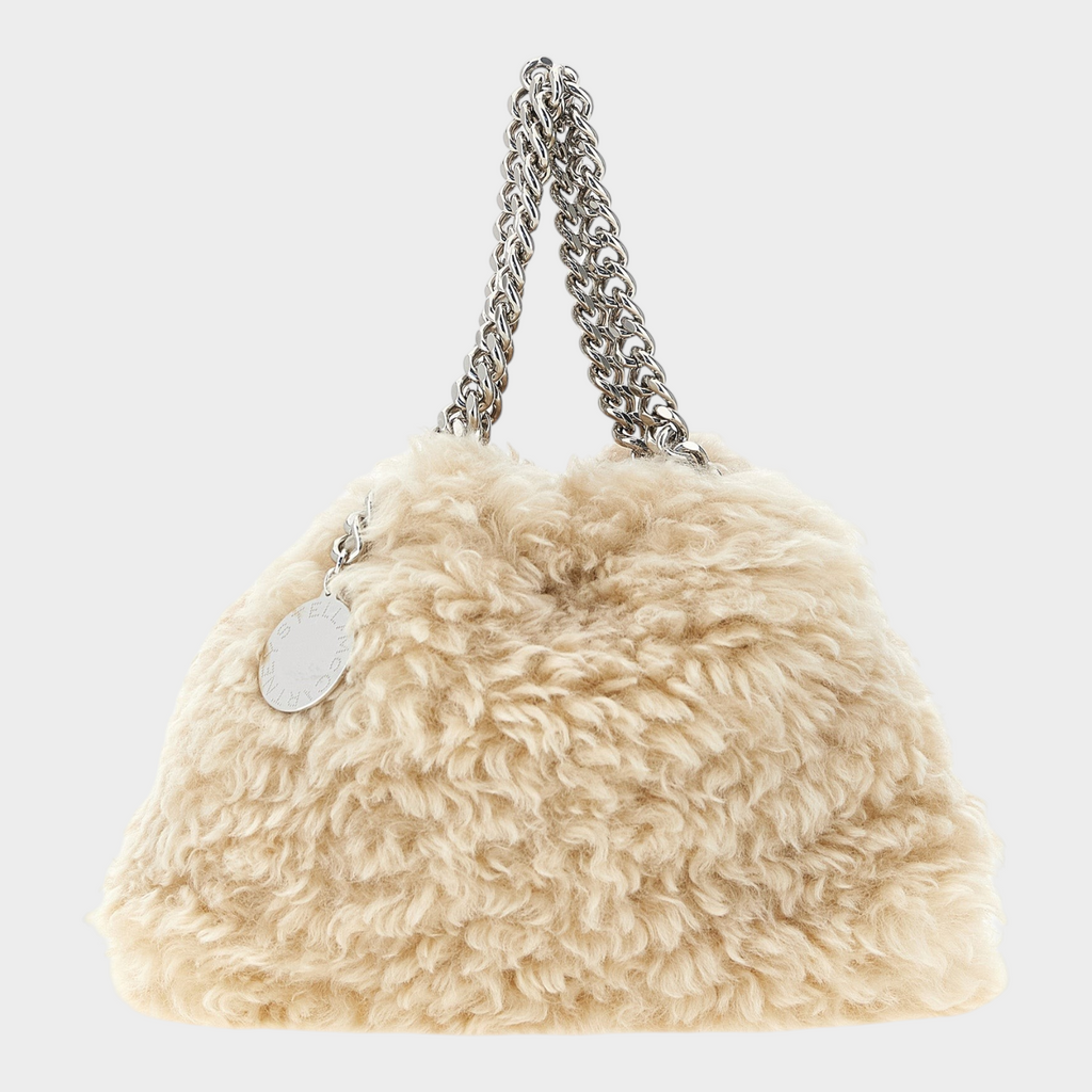 Esmire & Co Stella McCartney Falabella mini handbag in beige vegan shearling with silver chain handles and logo charm.