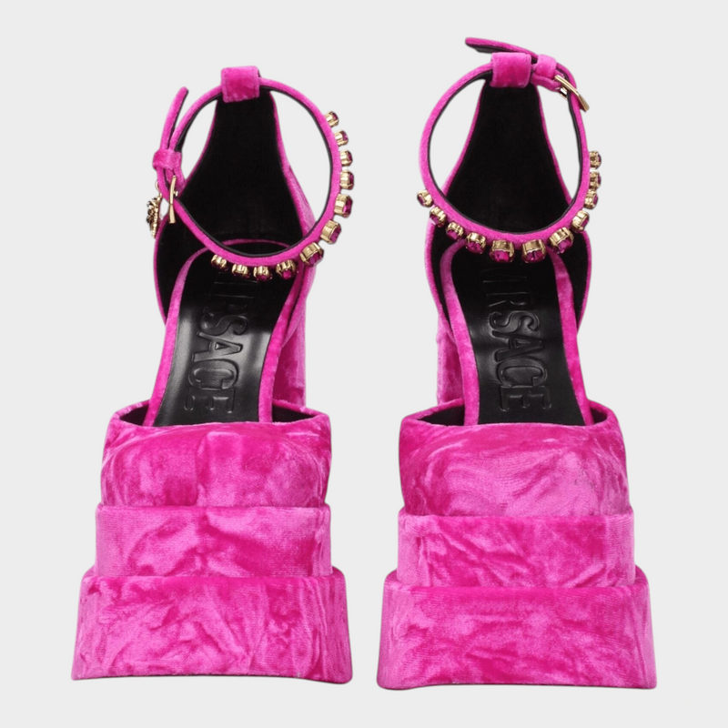 Esmire & Co Versace fuchsia velvet platform heels with rhinestone ankle straps and gold-tone buckle detail.