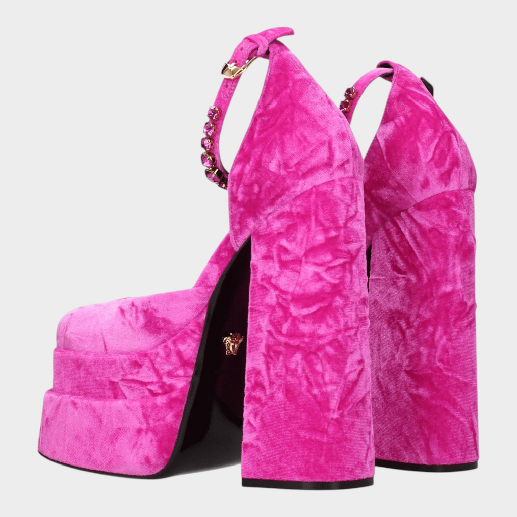 Esmire & Co Versace fuchsia velvet platform heels with rhinestone straps, gold-tone accents, and high block heels.