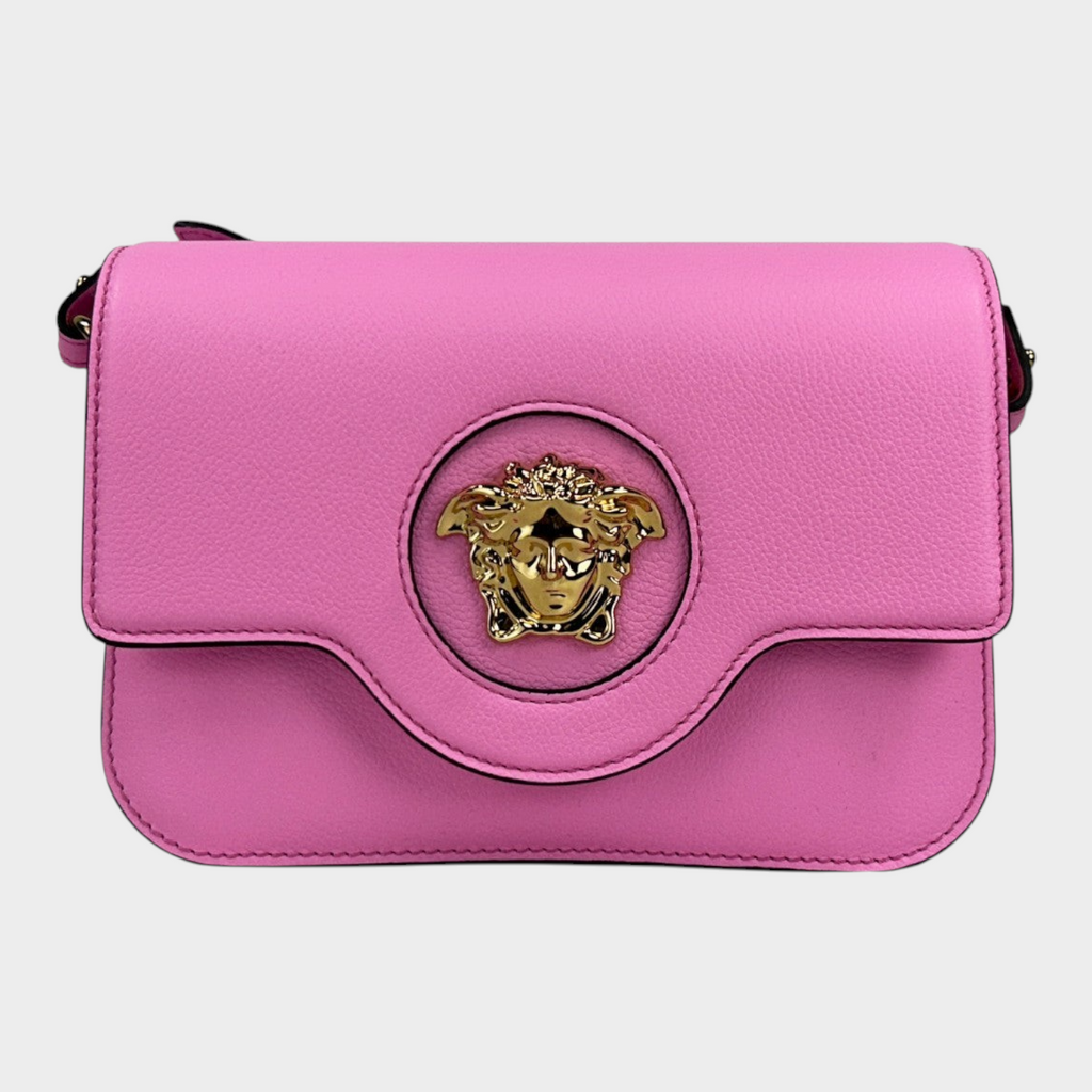 Esmire & Co Versace La Medusa pink pebbled leather crossbody bag with gold Medusa head hardware and magnetic flap.