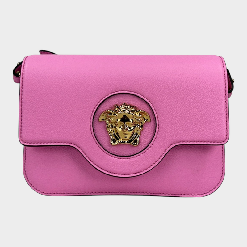 Esmire & Co Versace La Medusa pink pebbled leather crossbody bag with gold Medusa head hardware and magnetic flap.