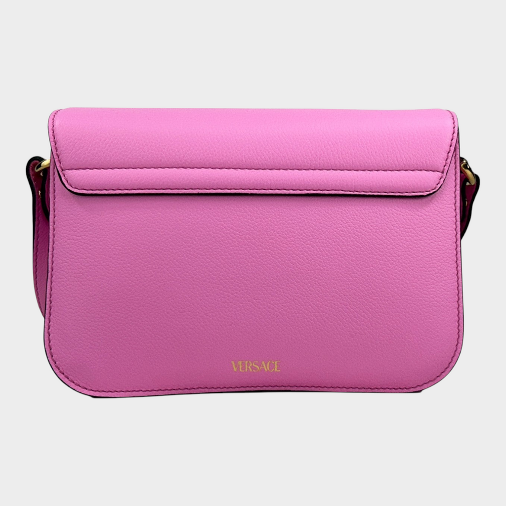 Esmire & Co Versace La Medusa pink pebbled leather crossbody bag with gold hardware and magnetic flap closure