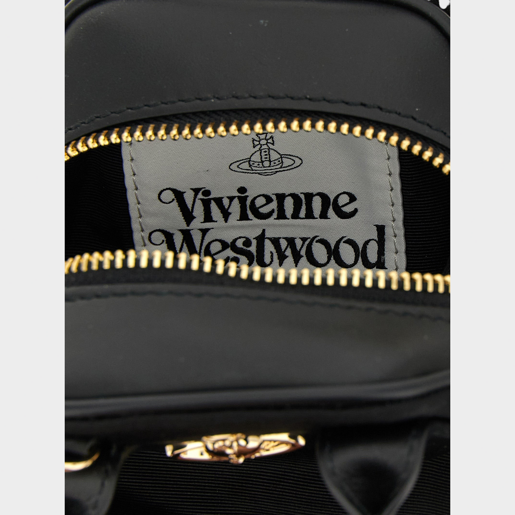 Esmire & Co Vivienne Westwood Mini Yasmine bag interior featuring a branded fabric label with gold zip hardware.
