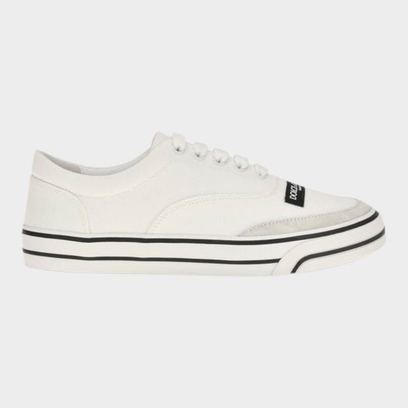 Esmire & Co white canvas low top sneakers with black striped rubber sole and branded label detail