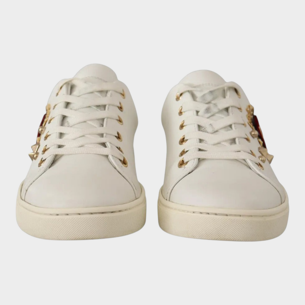 Esmire & Co Dolce & Gabbana white leather sneakers featuring gold studs and a red velvet heart detail.